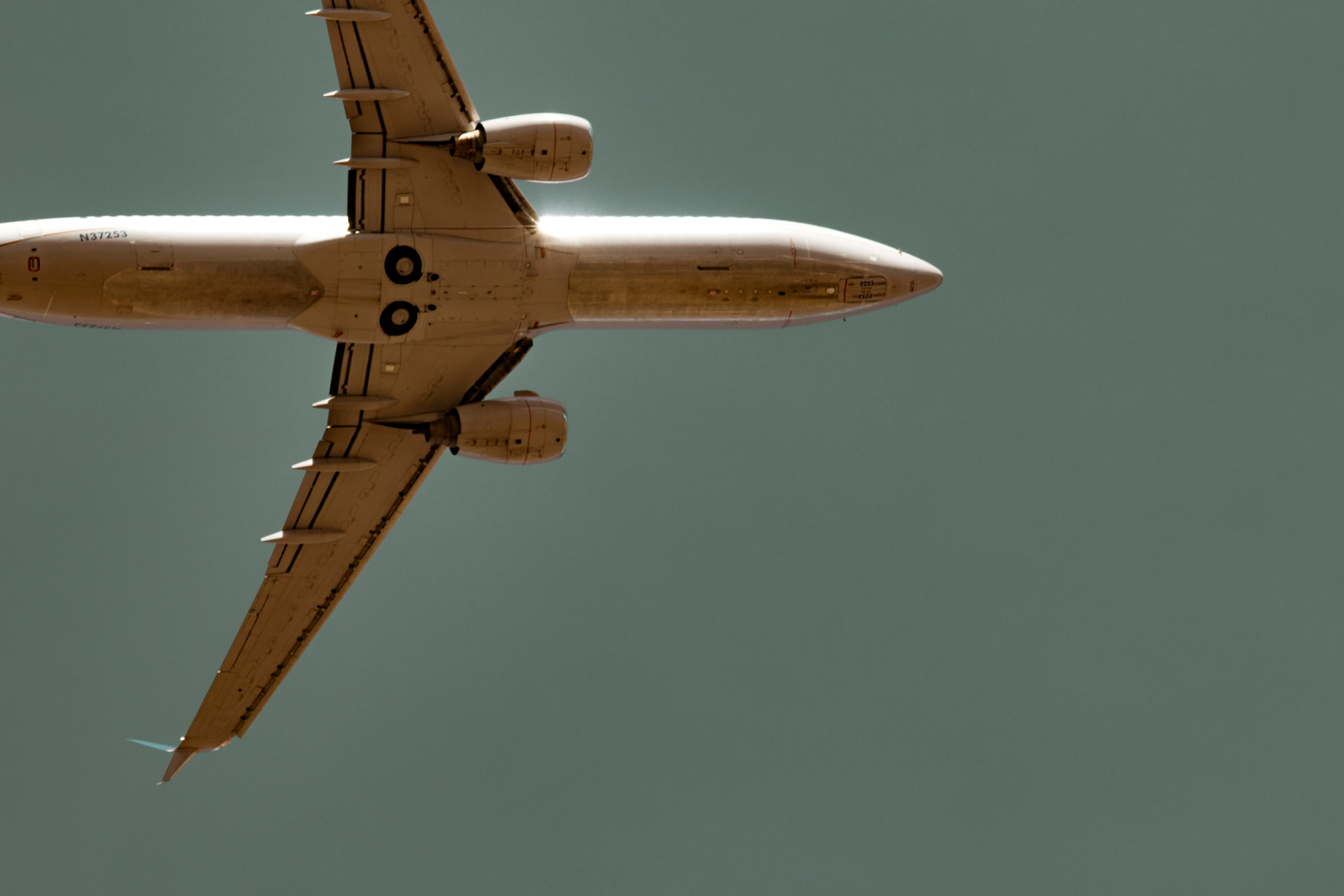 worm's-eye view of commercial airplane in sky